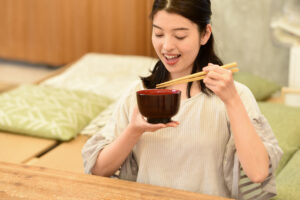 A Japanese woman taking the benefit of miso