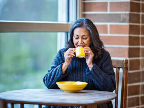 a woman warmed with a beverage