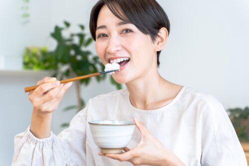 A Japanese woman eating rice